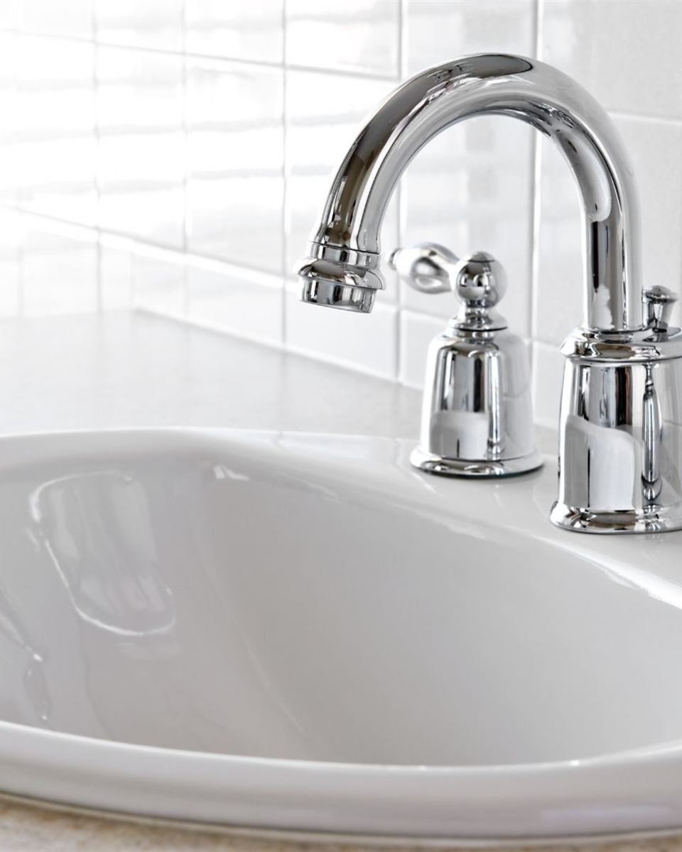 New single-handle faucet installed with fresh supply stops in a Reidsville bathroom