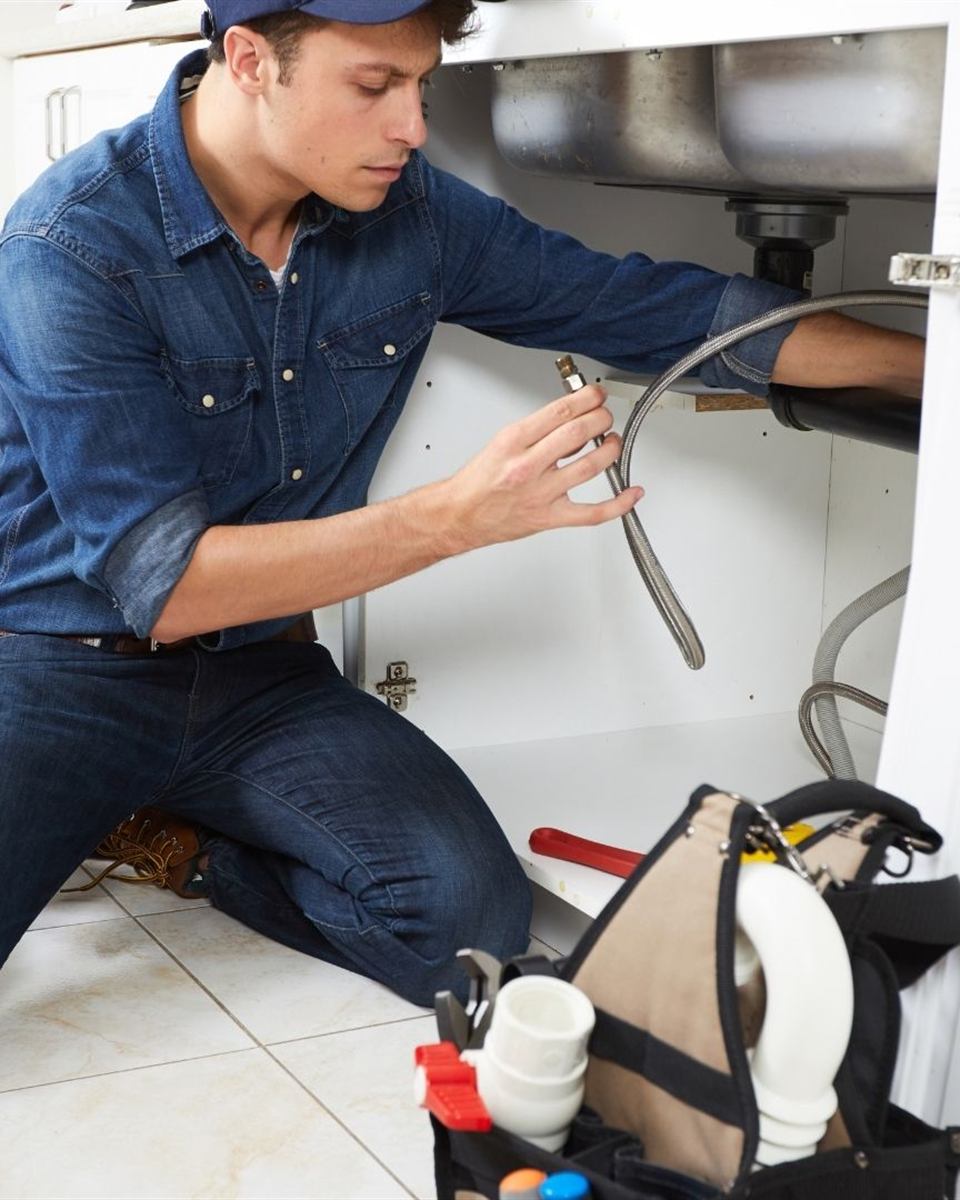 Local Reidsville plumber loading tools for a nearby service call