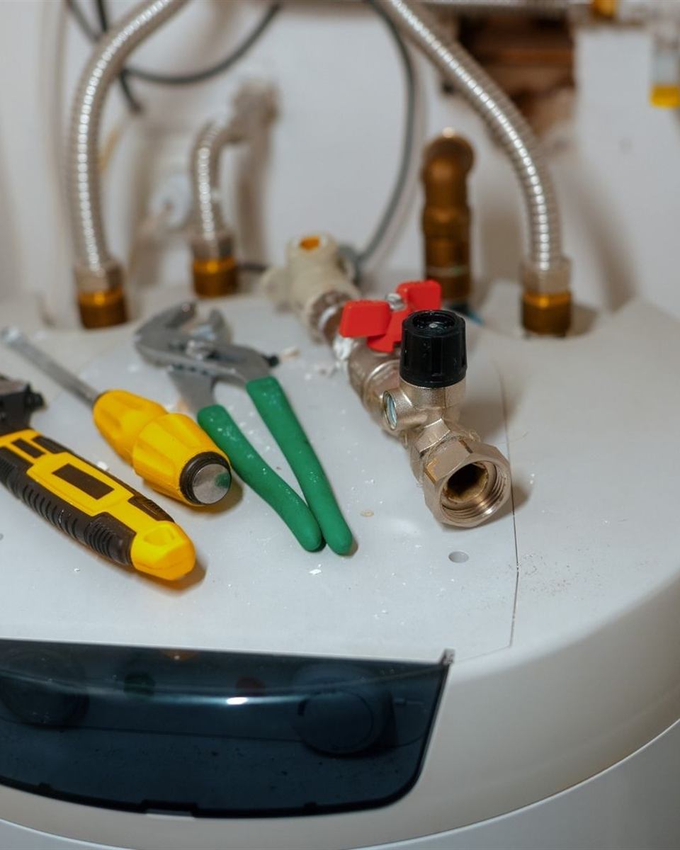 New 50-gallon water heater with clean code-compliant connections in a Reidsville home
