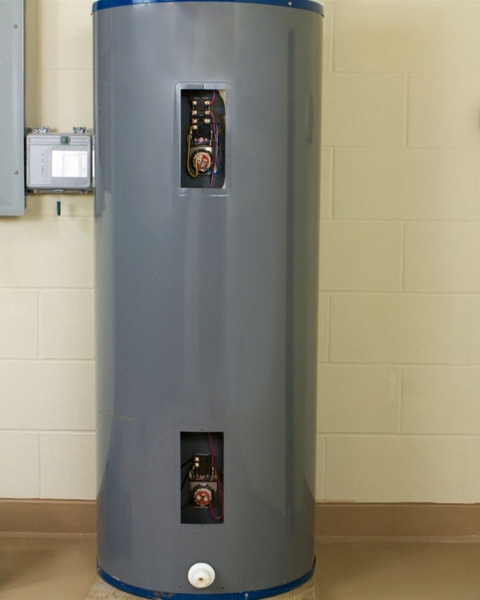 Checking a water heater breaker at the electrical panel in a Triad area home