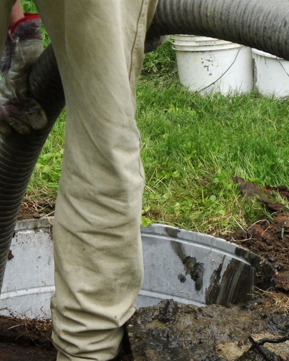 Septic alarm panel with warning light on at a Caswell County home before pump replacement