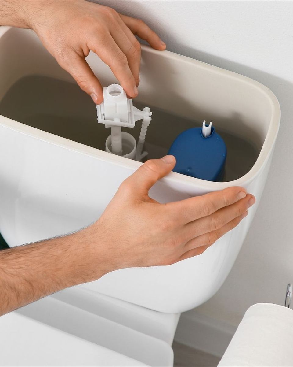Old rocking toilet with a failed base seal awaiting replacement
